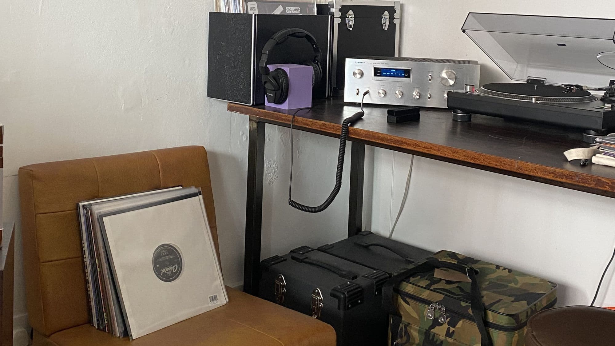 Listening corner with turntable, headphones and vinyl records inside Analogue Music record shop on Rochester High Street.